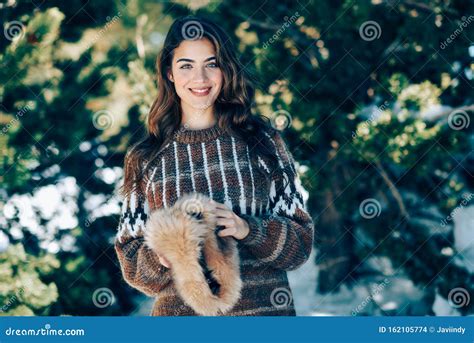 Young Woman Enjoying The Snowy Mountains In Winter Stock Photo Image