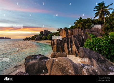 Beautiful sunset at amazing picturesque paradise beach. granite rocks