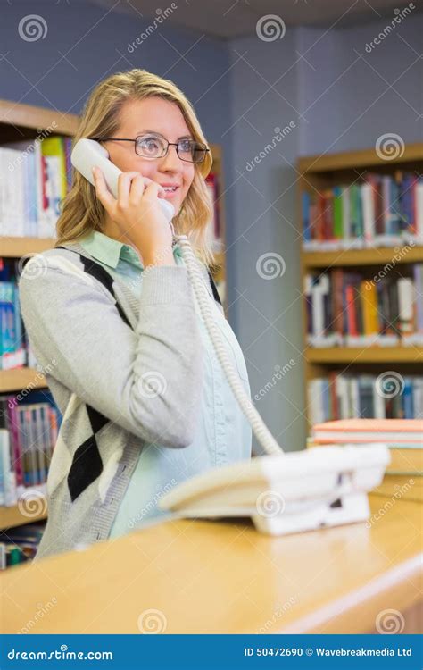 Pretty Librarian Working In The Library Stock Photography