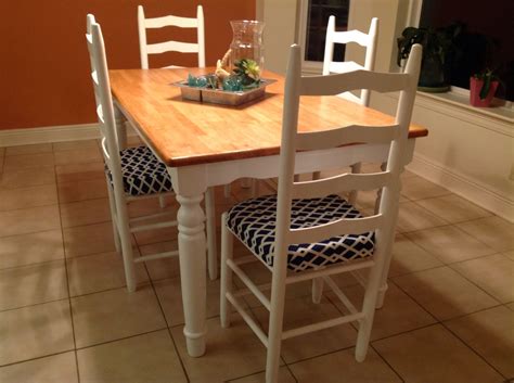 Refinishing wooden chairs by sanding with 100 grit sand paper then 400 grit then using polyurethane clear gloss Refinished kitchen table and chairs. White legs and natural finish butcher block top. Fabric is ...