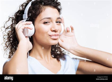 Charming Woman Listening To Music And Pouting Stock Photo Alamy