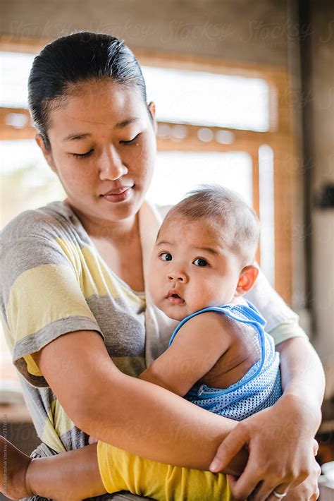 asian mother and her son by stocksy contributor chalit saphaphak stocksy