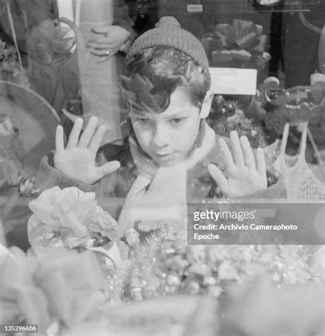 Boy Looking Through Shop Window Photos And Premium High Res Pictures