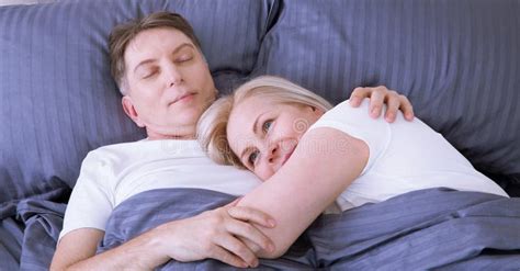 Couple In Bed Man And Woman Are Enjoying Spending Time Together While Lying In Bed Happy