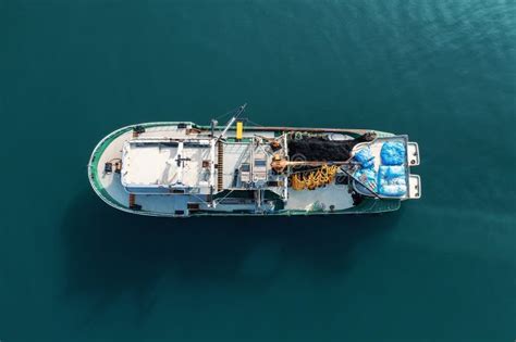 Fishing Boat Aerial View Top From Drone On Sea Surface Fishing And