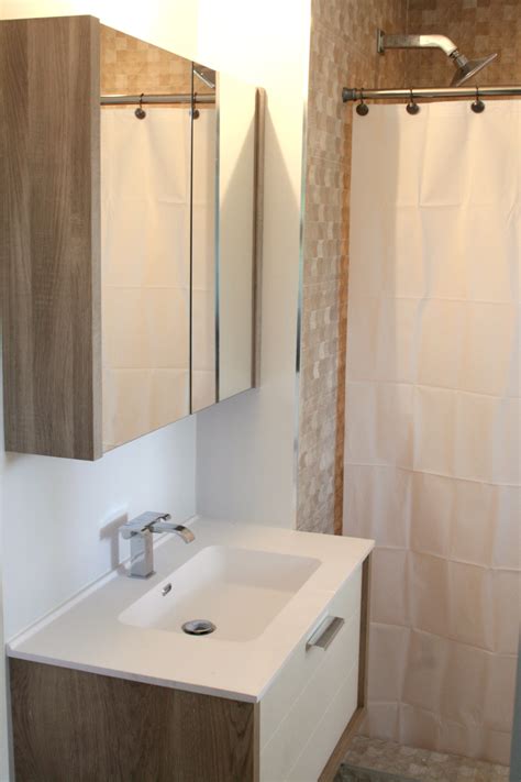 Choose a paint color that complements the room's. Remodeled bathrooms with matching Vanities & Porcelain Tile