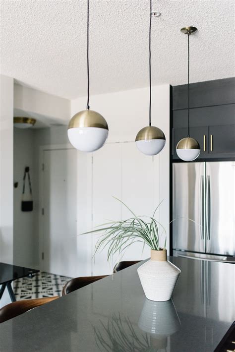 Black Kitchen With Brass Accents Pendant Lighting Dining Room