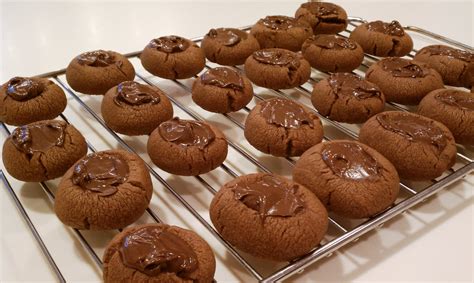 Allow cookies to cool completely. Nutella Thumbprints - Emily Bites