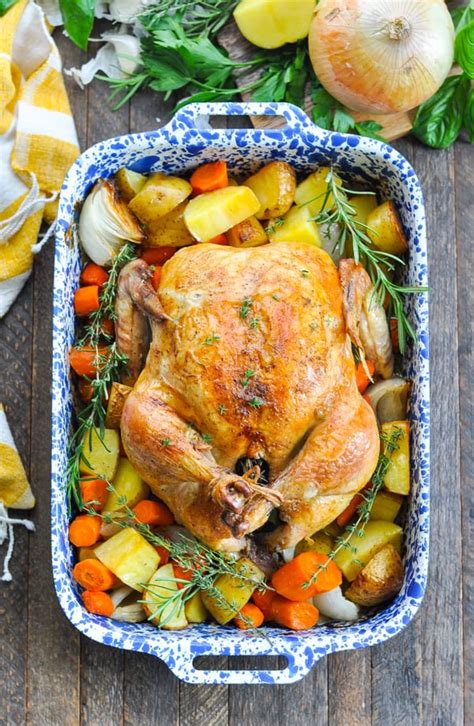 Rub remaining herb mixture under skin of chicken, working into breast and thigh areas. Crispy Roast Chicken with Vegetables - The Seasoned Mom