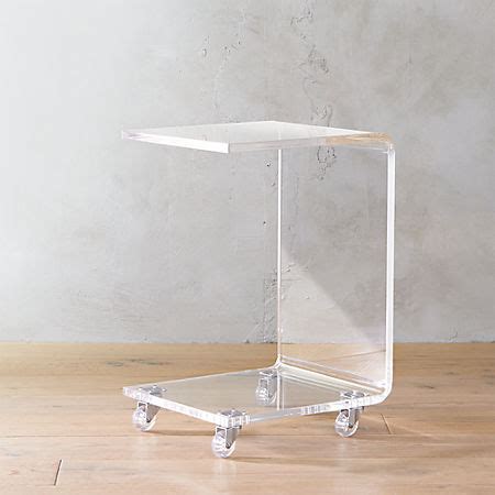 Helps you keep your things organized and the table top clear. DAANIS: Acrylic Coffee Table On Casters