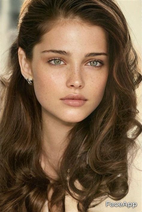 A Woman With Long Brown Hair And Blue Eyes