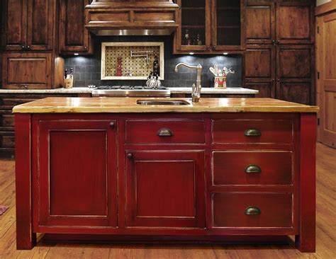 Upcycled barnwood style diy kitchen cabinets. Island: red distressed look. Im painting my kitchen cabinets like this. @Steven Mckenzie, or ...
