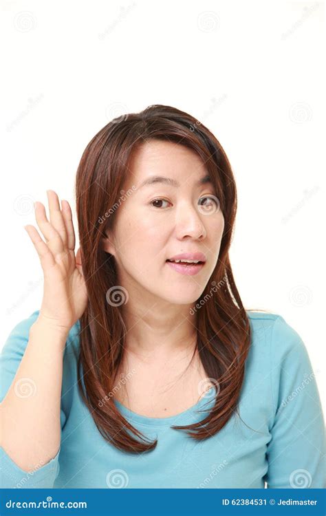 Woman With Hand Behind Ear Listening Closely Stock Image Image Of