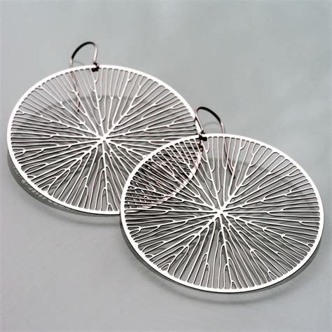 Check spelling or type a new query. Peltate Earrings - N-E-R-V-O-U-S SYSTEM - Touch of Modern