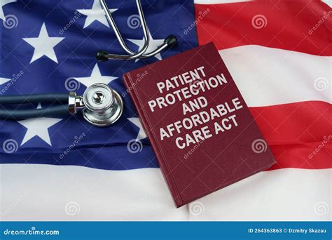 On The Us Flag Lies A Stethoscope And A Book With The Inscription