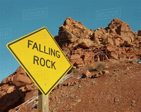 Falling Rock Sign In The Desert Stock Photo Dissolve