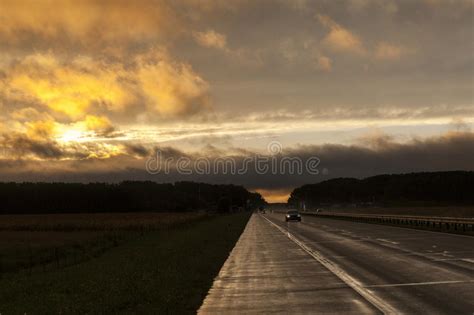 Highway During Sunset And Rain Stock Photo Image Of Fast