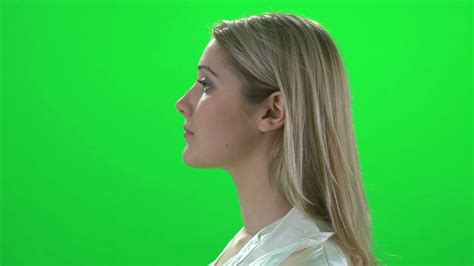 Side Profile Face View Of Young Blond Women Isolated On Greenscreen