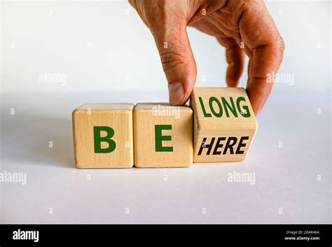 Be Here Belong Symbol Businessman Hand Turns A Cube And Changes Words