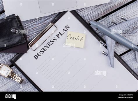 Clipboard With Business Plan And Credit Note Stock Photo Alamy