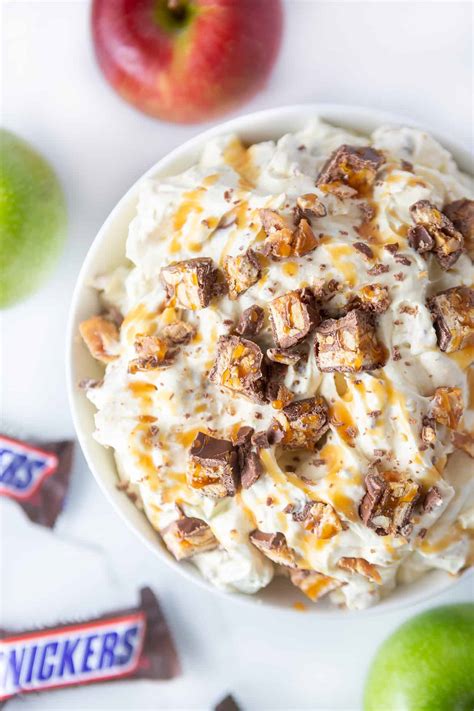 Gently stir in cool whip Easy Apple Snickers Salad - Design Eat Repeat