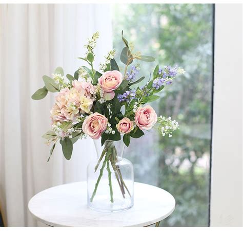 When people work together to create something this beautiful. Faux Rose Peony Eucalyptus Flower Arrangement in Glass ...