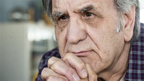 Thoughtful Elderly Man Sitting Alone At Home Stock Photo Image Of