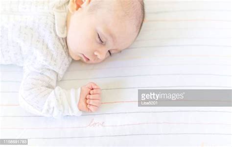 Baby Girl Sleeping In Crib Photos And Premium High Res Pictures Getty