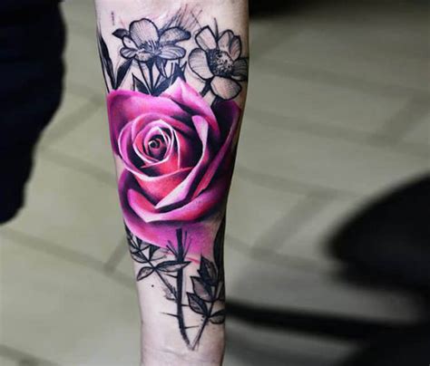 The tattoo includes a single rose which appears to be sitting amongst some leaves. Pink rose tattoo by Timur Lysenko | No. 1492