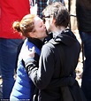 Make-up free Julianne Moore beams with delight after getting a kiss ...