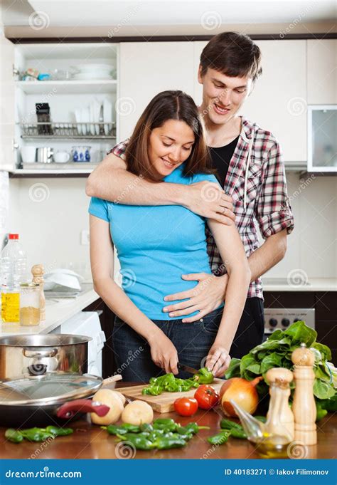 Man Flirting With Pretty Girl In Kitchen Stock Image Image Of House