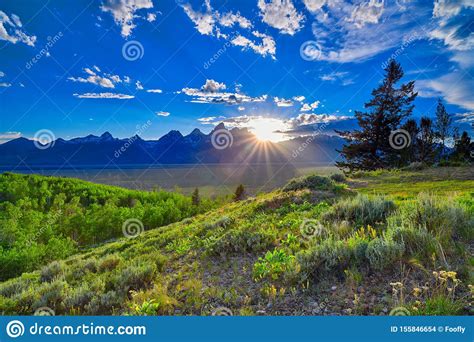 Sunset Over The Grand Teton Mountain Range Stock Photo Image Of