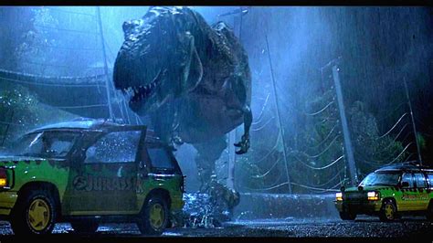 Download Jurassic Park T Rex At Rainy Park Wallpaper