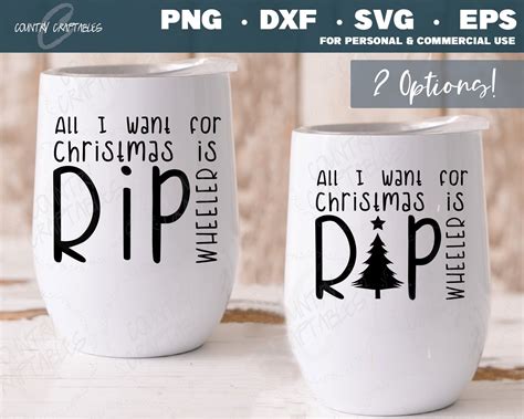 two white coffee mugs with christmas designs on them, one has the words