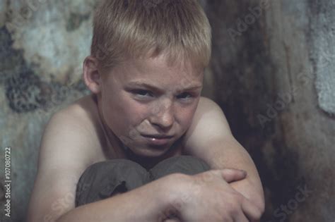 Weeping Boy Curled Up In Corner Stock Photo Adobe Stock