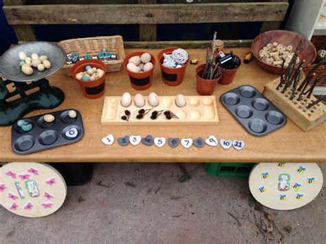 An Outdoor Table With Cupcakes Eggs And Other Items For Making Cookies