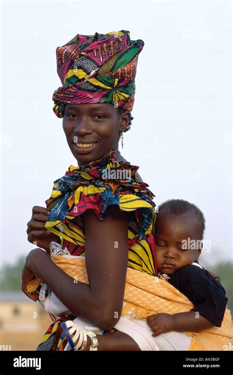 African Woman Carrying Baby On Back Banjul Gambia Stock Photo