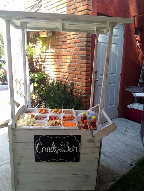 An Outdoor Food Stand With Condiments On It