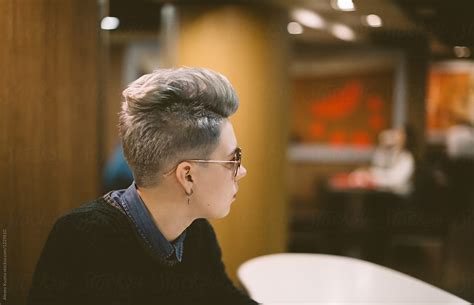 Portrait Of Young Lesbian Woman At Coffee Shop By Alexey Kuzma