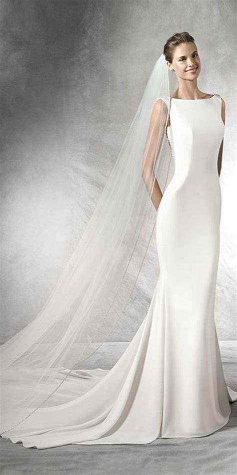 A Woman Wearing A Wedding Dress With A Veil