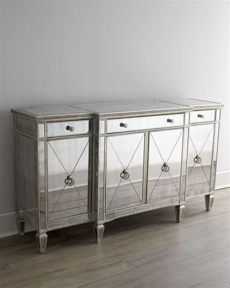 Covered in antiqued mirrored veneers. Amelie Mirrored Buffet