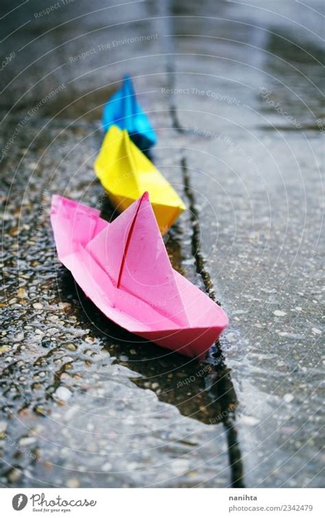 Color Paper Boats In A Rainy Day A Royalty Free Stock Photo From