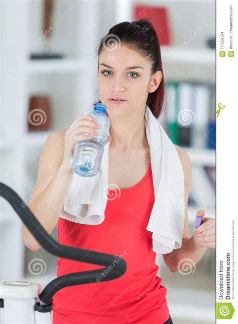 Fit Young Woman Drinking Water After Step Exercise Stock