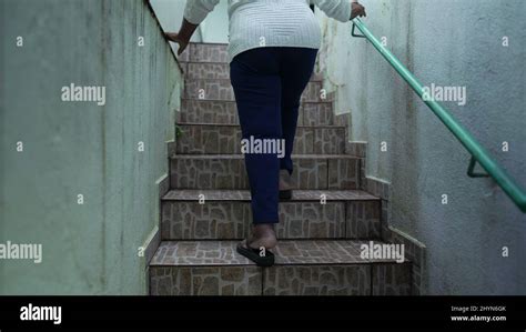 Older Woman Going Up The Stairs At Home Arriving House Stock Photo Alamy