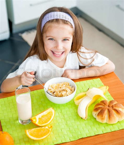 Little Girl Eating Her Breakfast Stock Image Colourbox