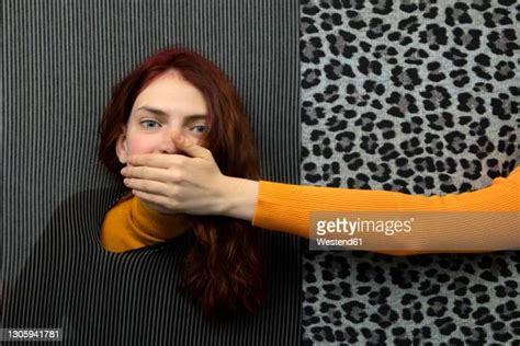 Hand Over Mouth Photos And Premium High Res Pictures Getty Images