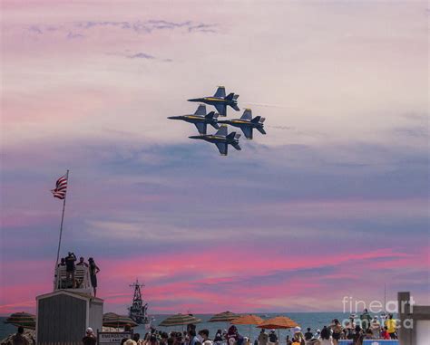 Four Us Navy Blue Angels Jets Flying In Formation During Sunset
