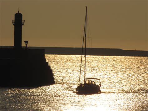 Lighthouse And Sailboat Free Stock Photo Public Domain Pictures