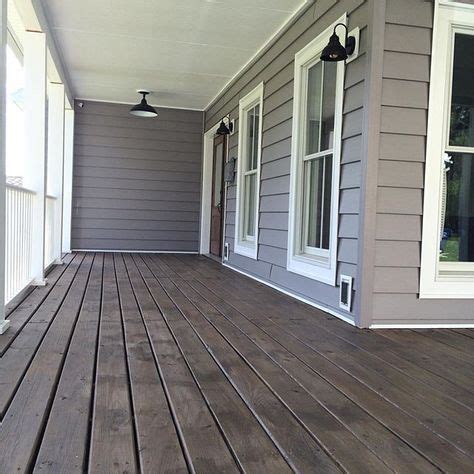 We love dark gray siding with white trim, and enjoyed reviewing several of the most popular gray siding materials when selecing a color for our new home! Image result for grey siding which deck color | Staining ...
