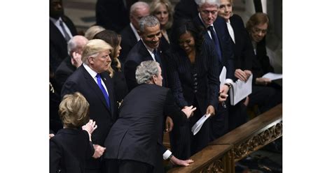 george w bush gives michelle obama candy at father s funeral popsugar news photo 4